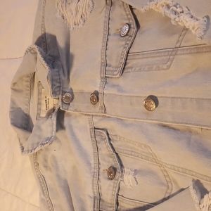 Light wash blue distressed denim jacket